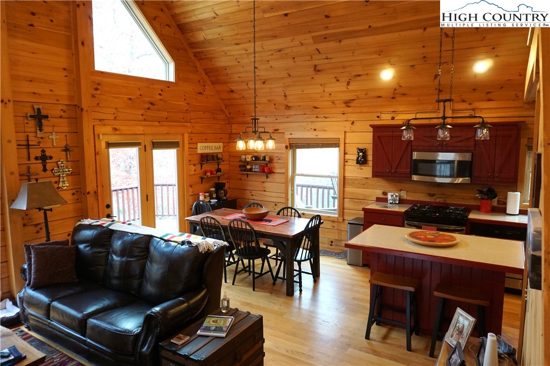 182 Buckland Road Grassy Creek, NC 28631 - Photo 12 of 38 a living room with furniture and a flat screen tv