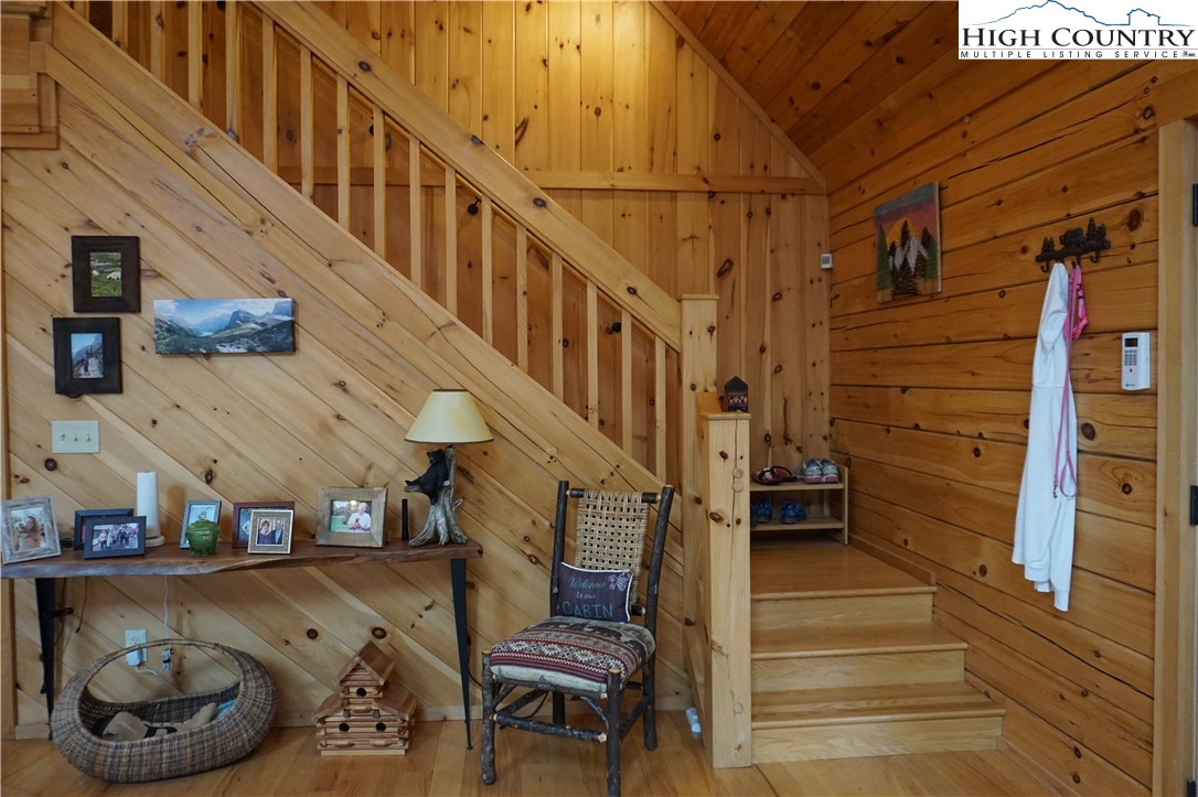 182 Buckland Road Grassy Creek, NC 28631 - Photo 13 of 38 a view of entryway and hall with wooden floor