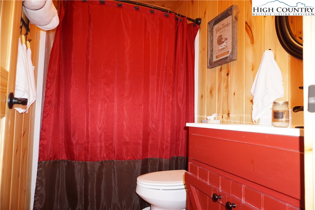 182 Buckland Road Grassy Creek, NC 28631 - Photo 16 of 38 a bathroom with a sink and a toilet