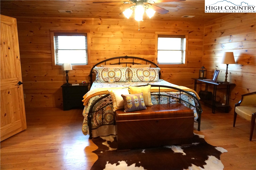 182 Buckland Road Grassy Creek, NC 28631 - Photo 18 of 38 a bedroom with a bed and window