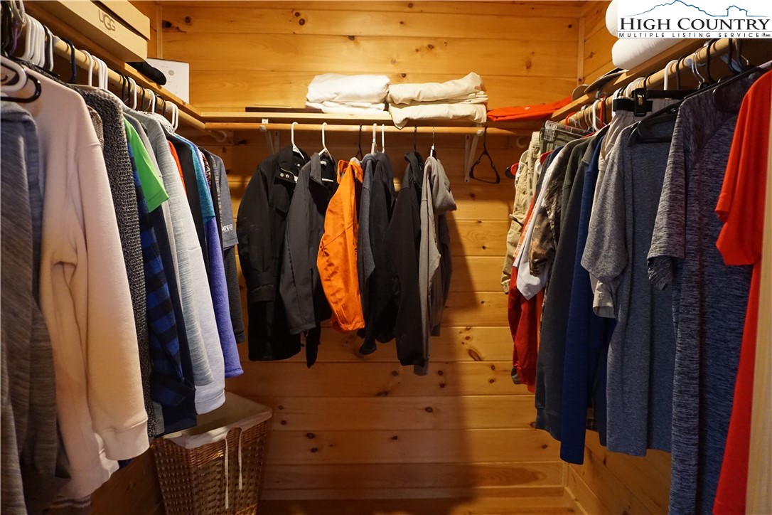 182 Buckland Road Grassy Creek, NC 28631 - Photo 19 of 38 a view of walk in closet with clothes and shoes
