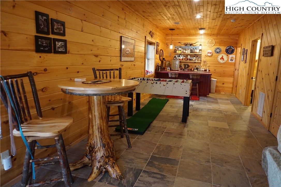182 Buckland Road Grassy Creek, NC 28631 - Photo 24 of 38 a view of a patio with table and chairs