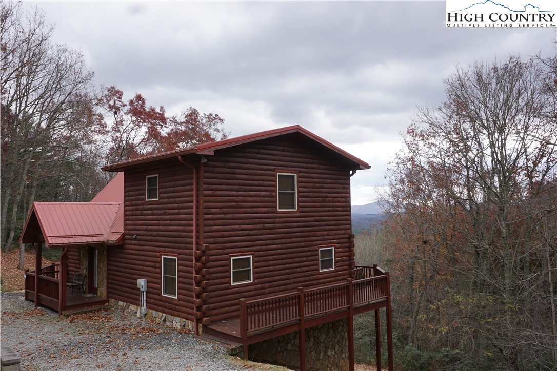 182 Buckland Road Grassy Creek, NC 28631 - Photo 28 of 38 a front view of a house with a garden