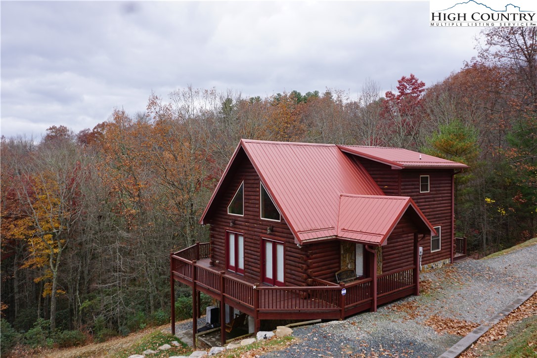 182 Buckland Road Grassy Creek, NC 28631 - Photo 30 of 38 a aerial view of a house with a yard