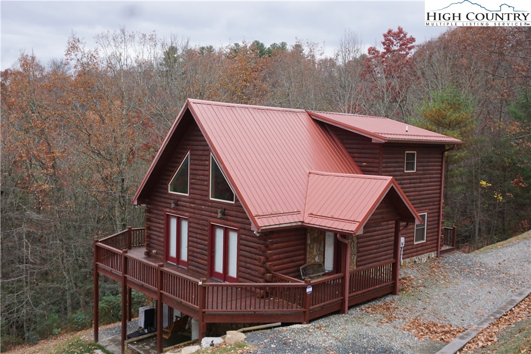 182 Buckland Road Grassy Creek, NC 28631 - Photo 32 of 38 a aerial view of a house with a yard