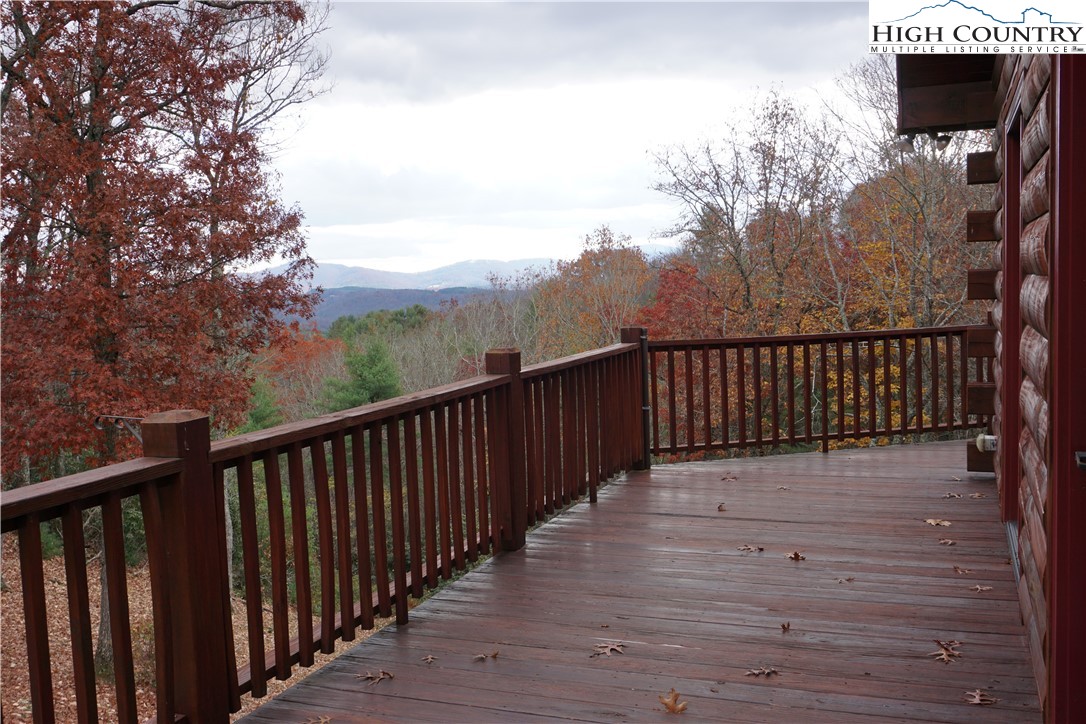 182 Buckland Road Grassy Creek, NC 28631 - Photo 34 of 38 a view of deck with wooden floor and outdoor seating