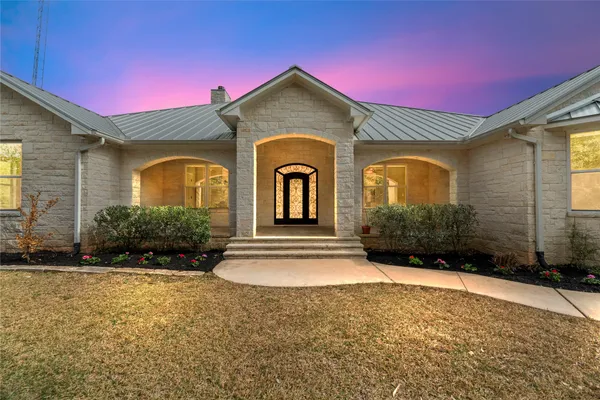 a front view of a house with yard