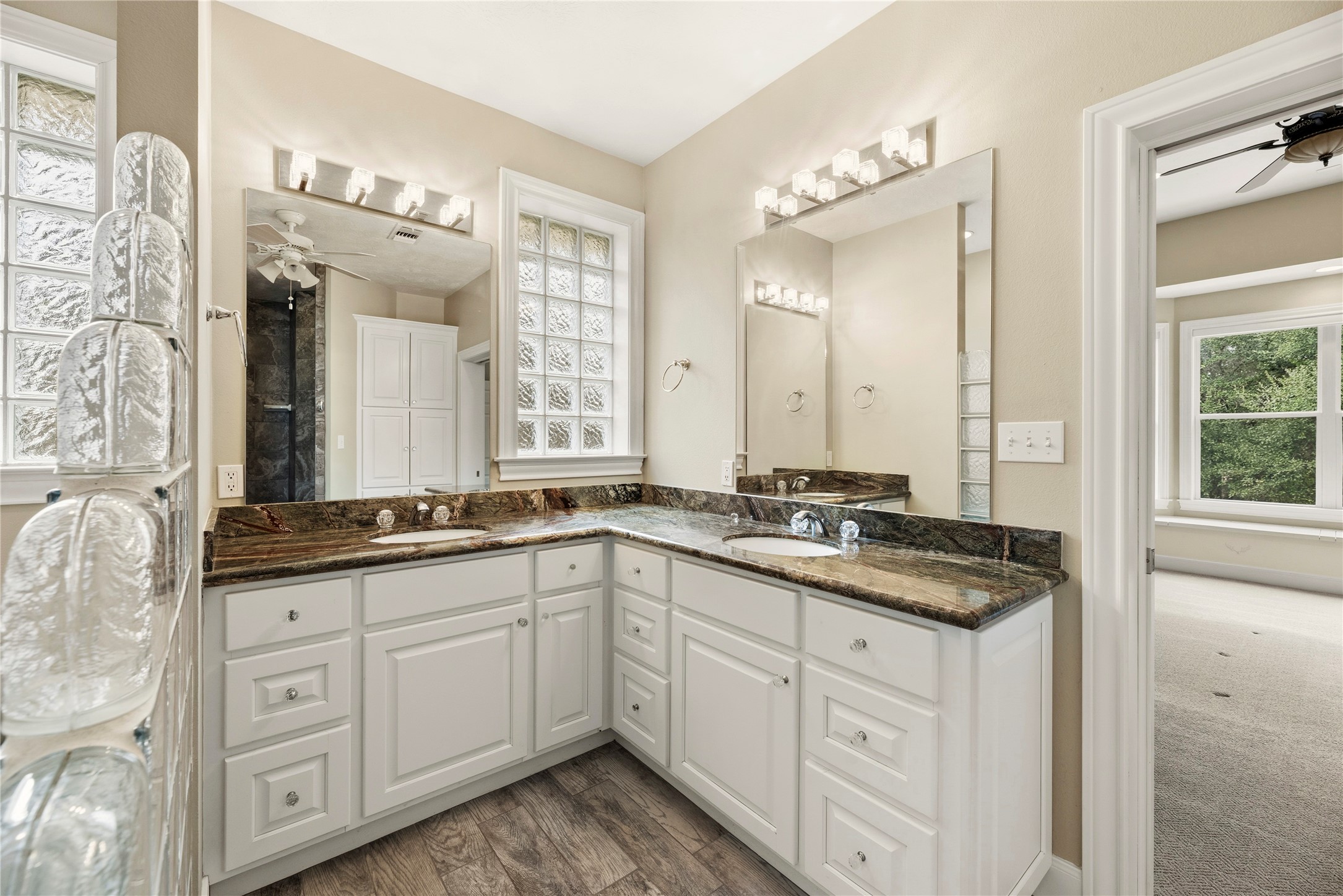 2051 Hillview Road Bellville, TX 77418 - Photo 23 of 47 Primary bathroom includes a dual sink marble vanity, walk-in shower and large closet.