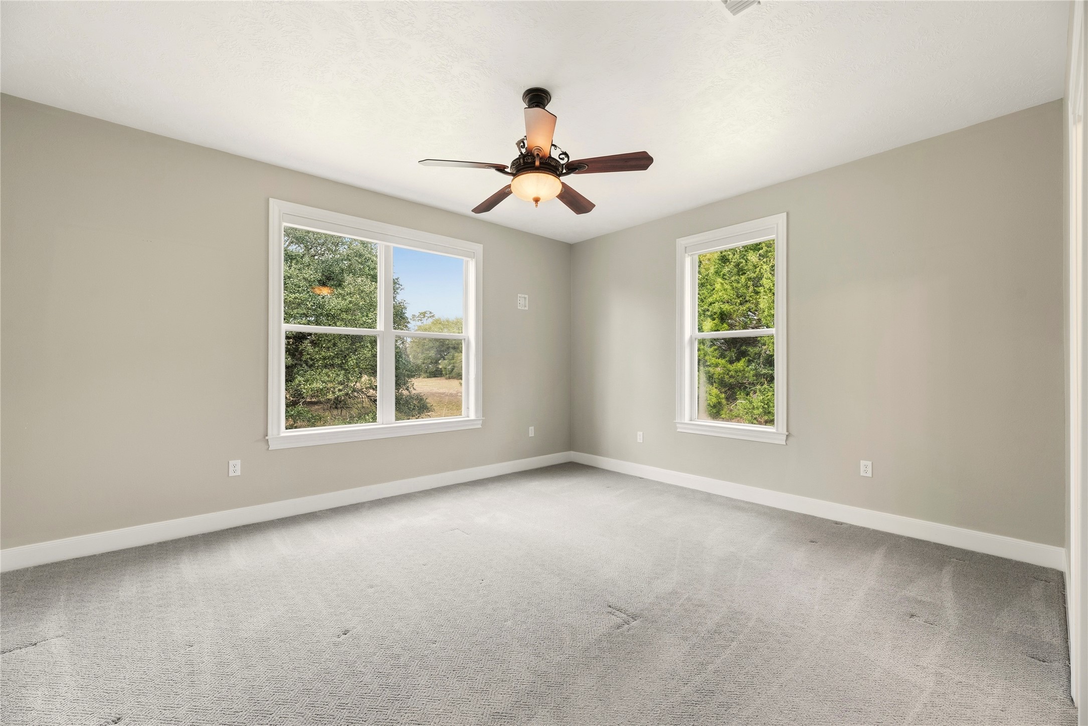 2051 Hillview Road Bellville, TX 77418 - Photo 25 of 47 Both secondary bedrooms are spacious and wheelchair accessible with plush carpet, ceiling fans and large closets. They are connected by a Jack n' Jill bathroom.