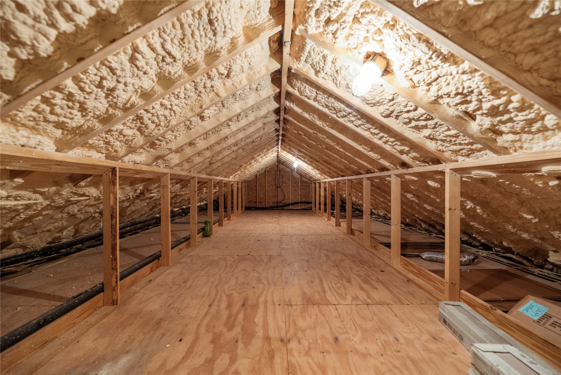 2051 Hillview Road Bellville, TX 77418 - Photo 30 of 47 Large climate-controlled attic with stairs and a handrail.