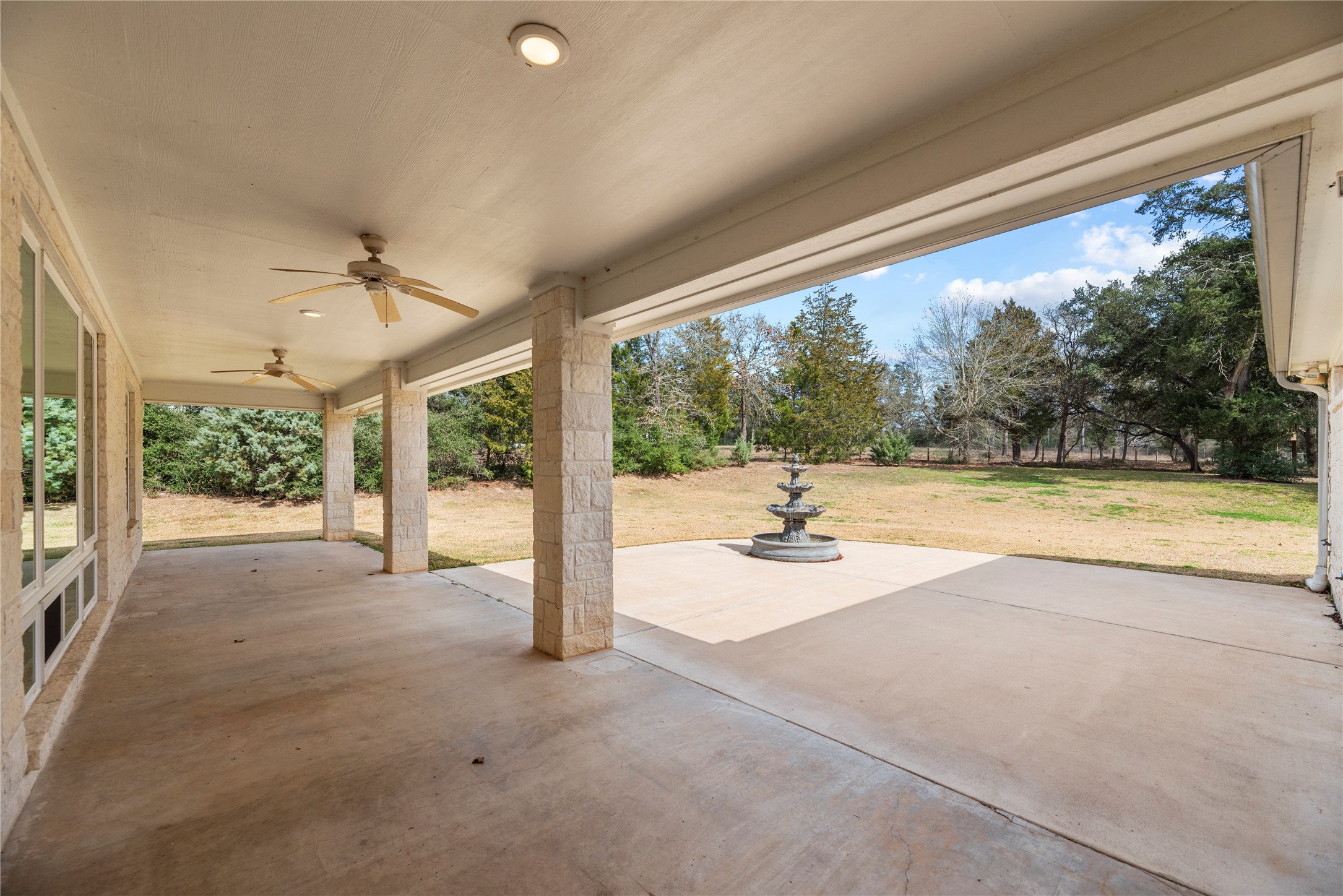 2051 Hillview Road Bellville, TX 77418 - Photo 34 of 47 Huge back patio with a gas grill connection and a tranquil 5' fountain.