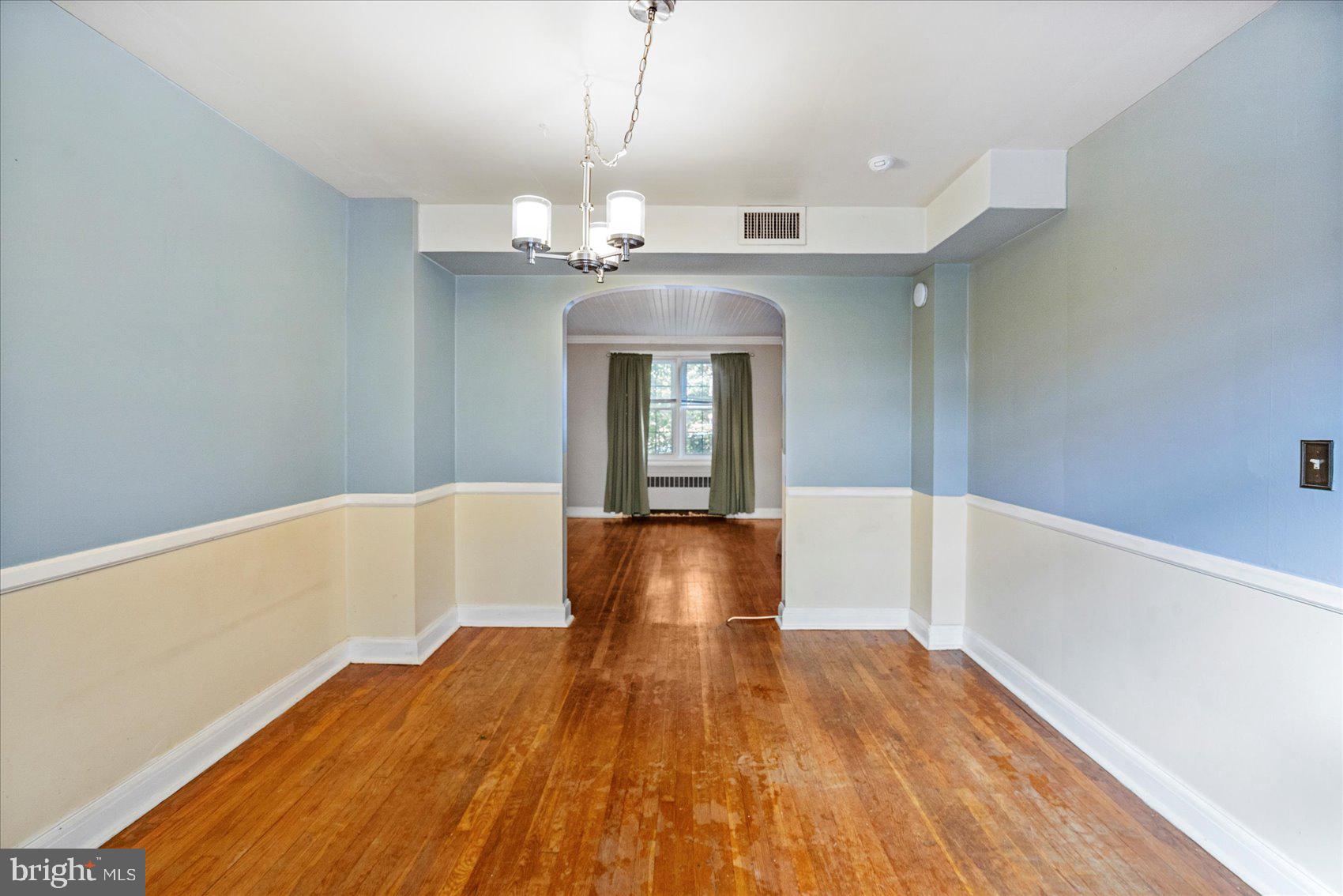 3915 Rexmere Road Baltimore, MD 21218 - Photo 8 of 41 a view of livingroom and kitchen with wooden floor
