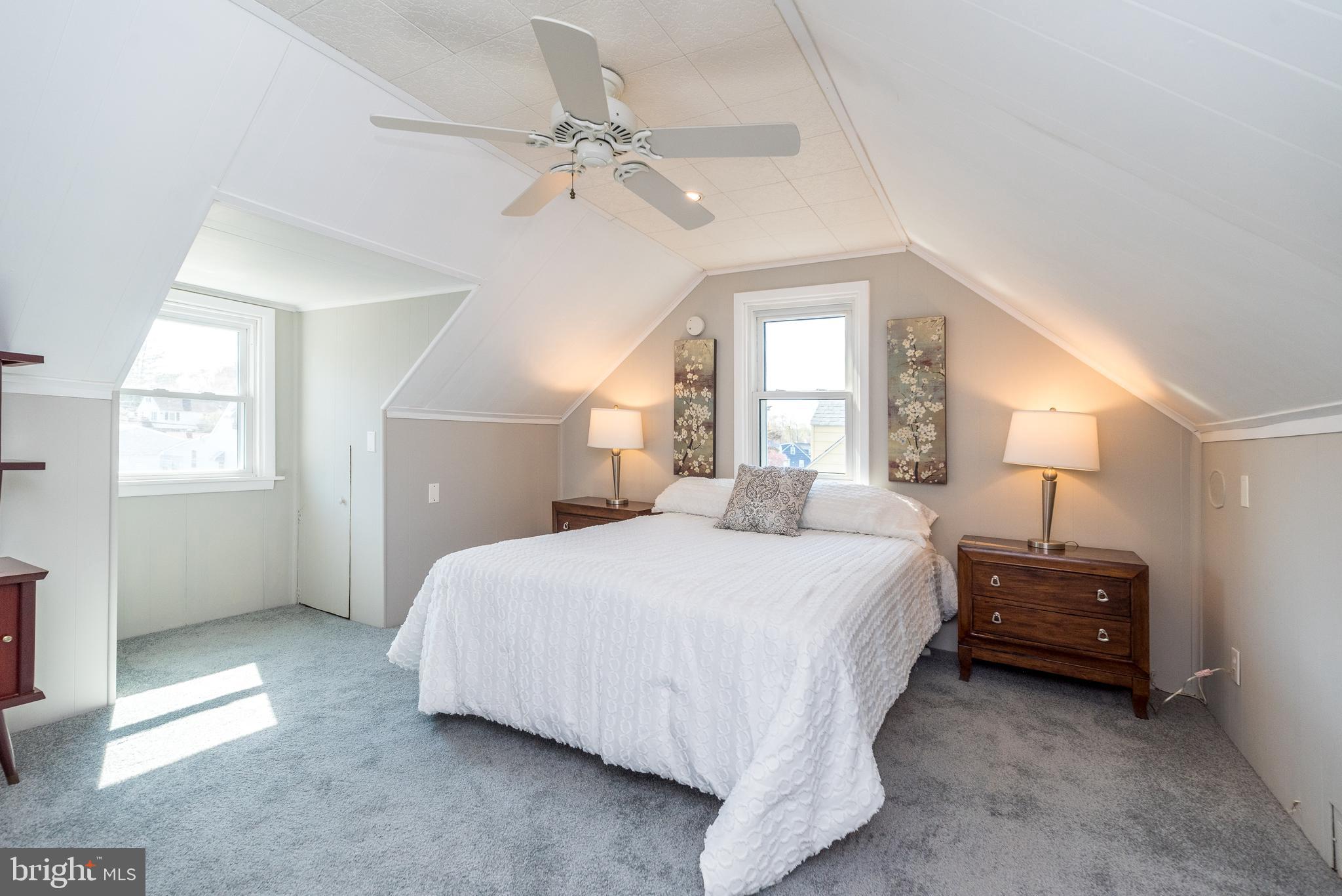 26 Shirley Road Hatboro, PA 19040 - Photo 27 of 50 a bedroom with a bed and a chandelier