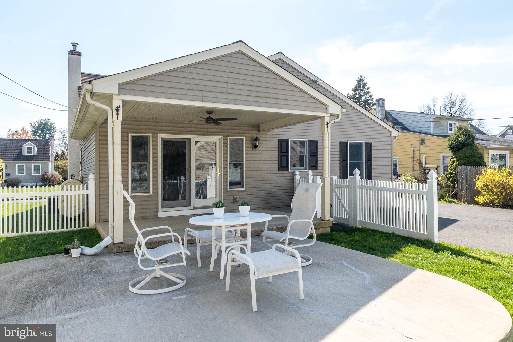 26 Shirley Road Hatboro, PA 19040 - Photo 40 of 50 a view of a patio with table and chairs and wooden fence
