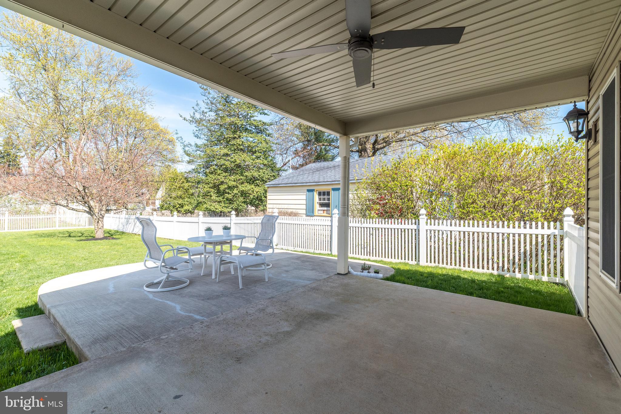26 Shirley Road Hatboro, PA 19040 - Photo 44 of 50 a view of patio with table and chairs and floor to ceiling window