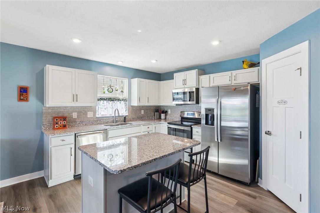 3797 Willow Way Perry, OH 44081 - Photo 2 of 44 Lovely functional kitchen with island and pantry