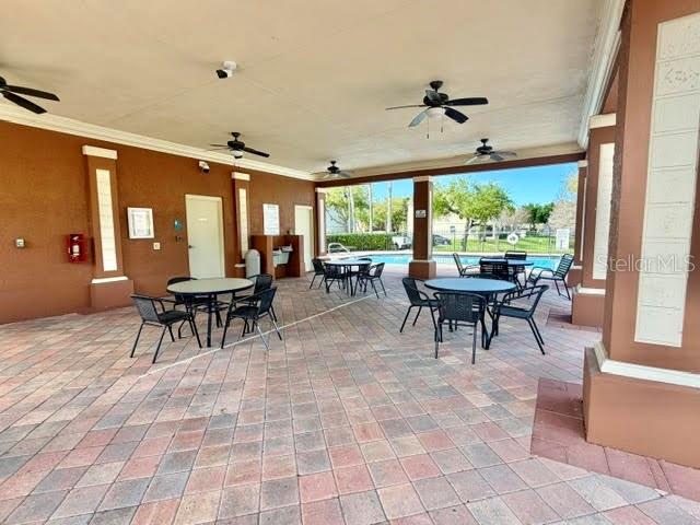 709 Fortanini Circle Ocoee, FL 34761 - Photo 17 of 22 a living room with furniture a large window and a fireplace