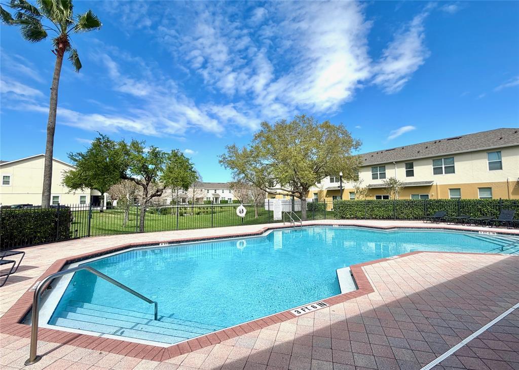 709 Fortanini Circle Ocoee, FL 34761 - Photo 18 of 22 a view of swimming pool from a lounge chair