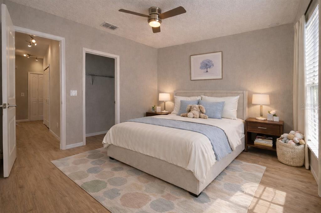 709 Fortanini Circle Ocoee, FL 34761 - Photo 8 of 22 a bedroom with a bed and window