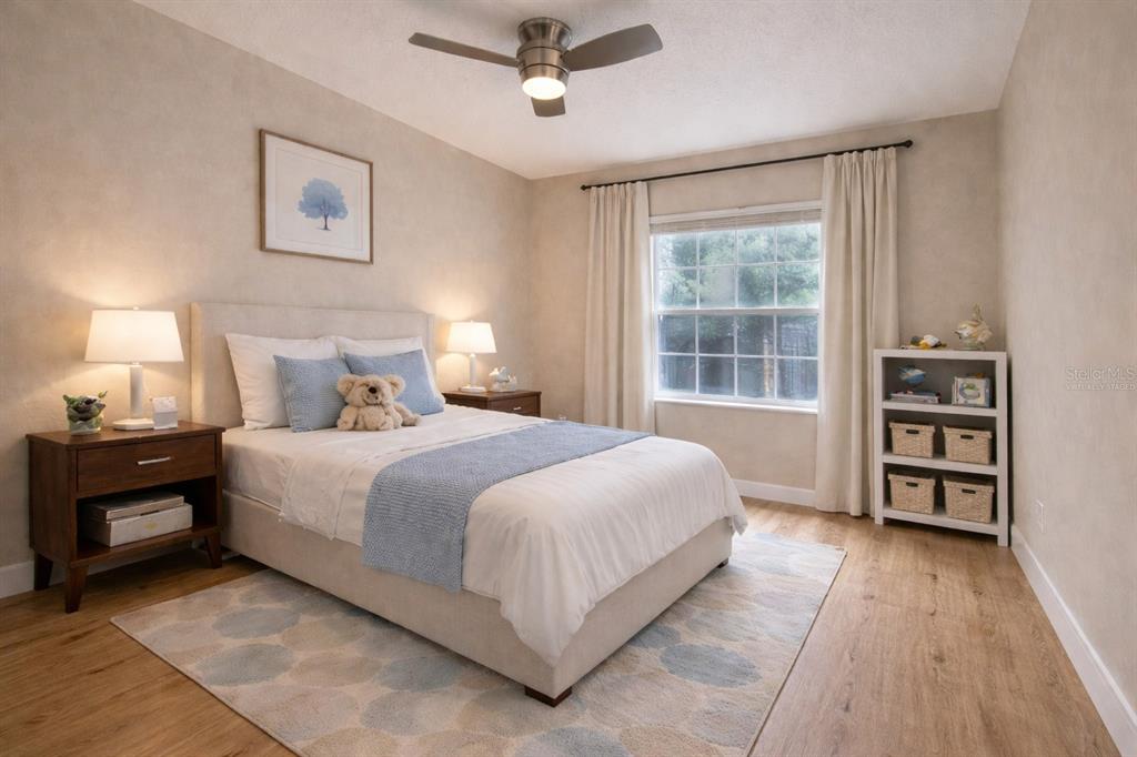 709 Fortanini Circle Ocoee, FL 34761 - Photo 9 of 22 a bedroom with a bed and a window