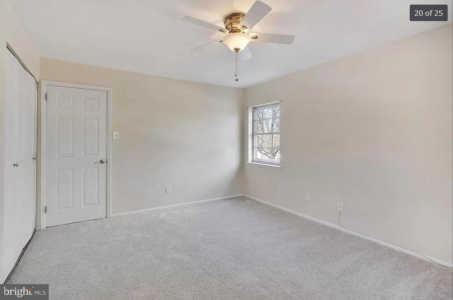 450 Old Forge Crossing, Unit 450 Devon, PA 19333 - Photo 14 of 16 an empty room with a window and a fan