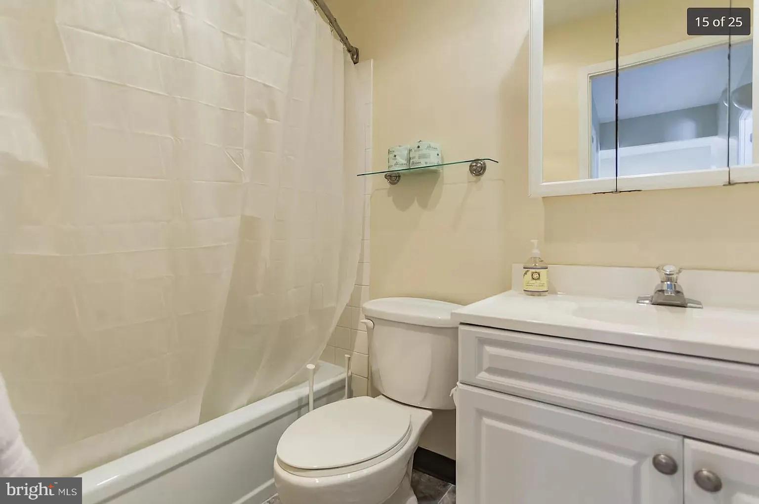 450 Old Forge Crossing, Unit 450 Devon, PA 19333 - Photo 15 of 16 a bathroom with a toilet a sink and shower