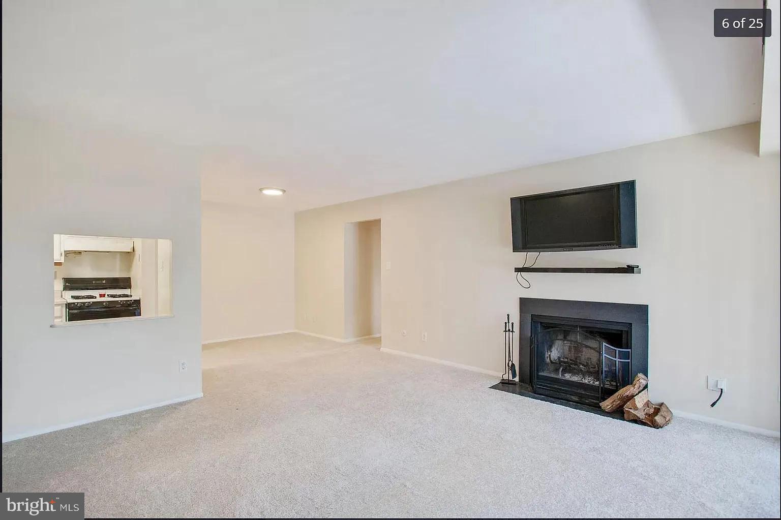 450 Old Forge Crossing, Unit 450 Devon, PA 19333 - Photo 4 of 16 a view of a livingroom with furniture and a fireplace
