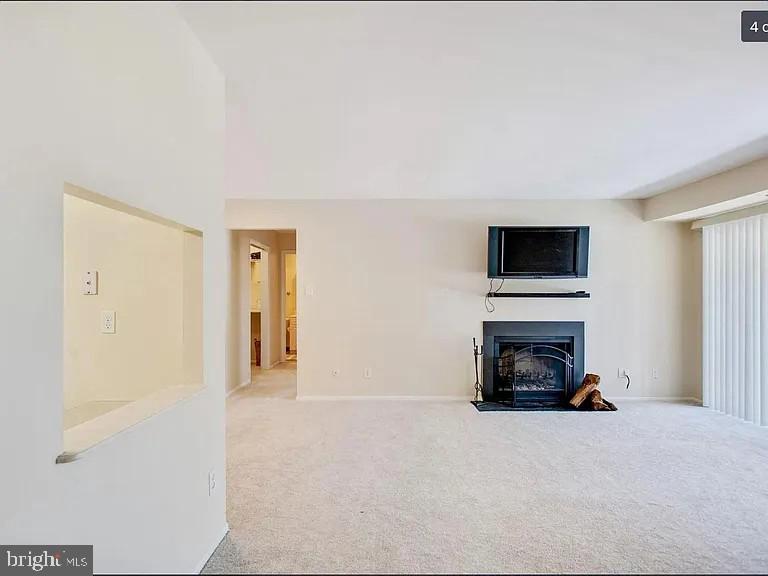 450 Old Forge Crossing, Unit 450 Devon, PA 19333 - Photo 5 of 16 a living room with furniture and a fireplace