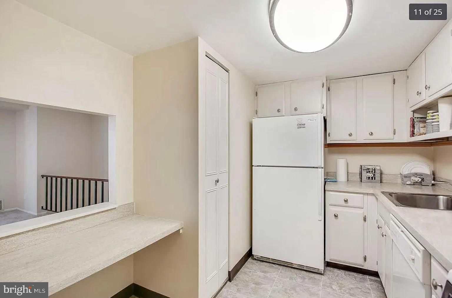450 Old Forge Crossing, Unit 450 Devon, PA 19333 - Photo 9 of 16 a white refrigerator freezer sitting inside of a kitchen