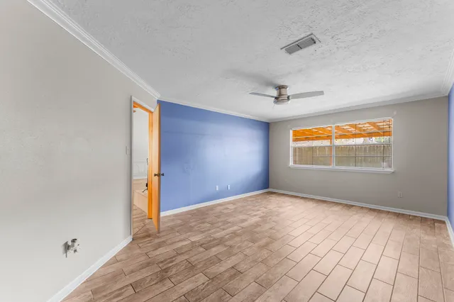 a view of an empty room and window