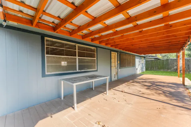 a bedroom with a bed and a flat tv screen