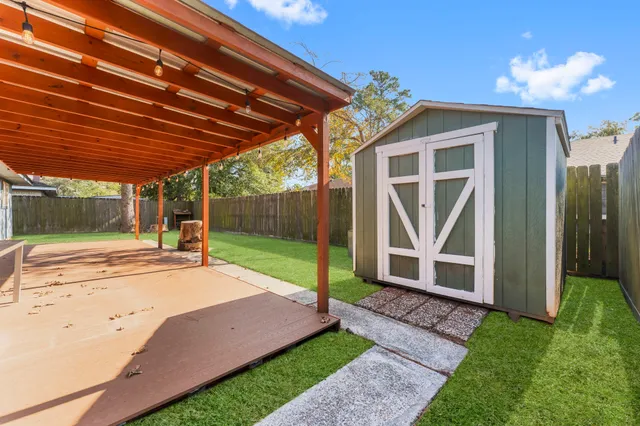 a view of a backyard with a garden and plants