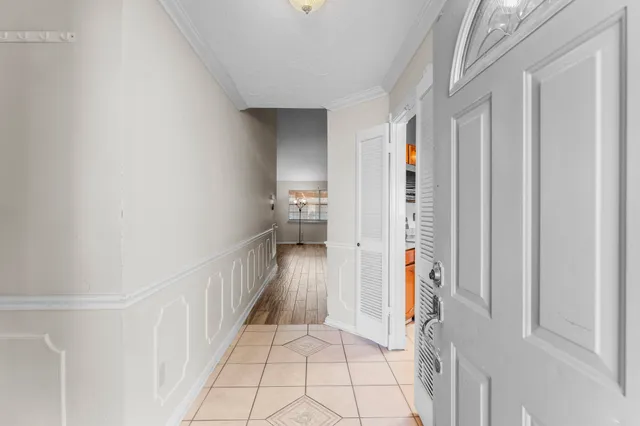 a view of hallway with wooden floor