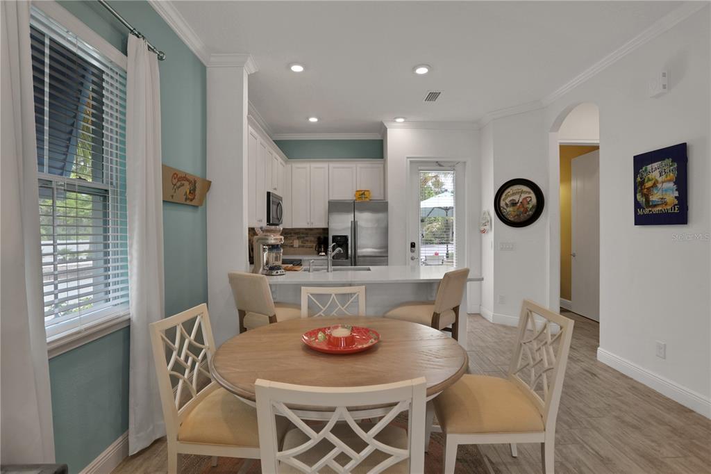 3083 Key Lime Loop Kissimmee, FL 34747 - Photo 15 of 82 a view of a dining room with furniture and a large window