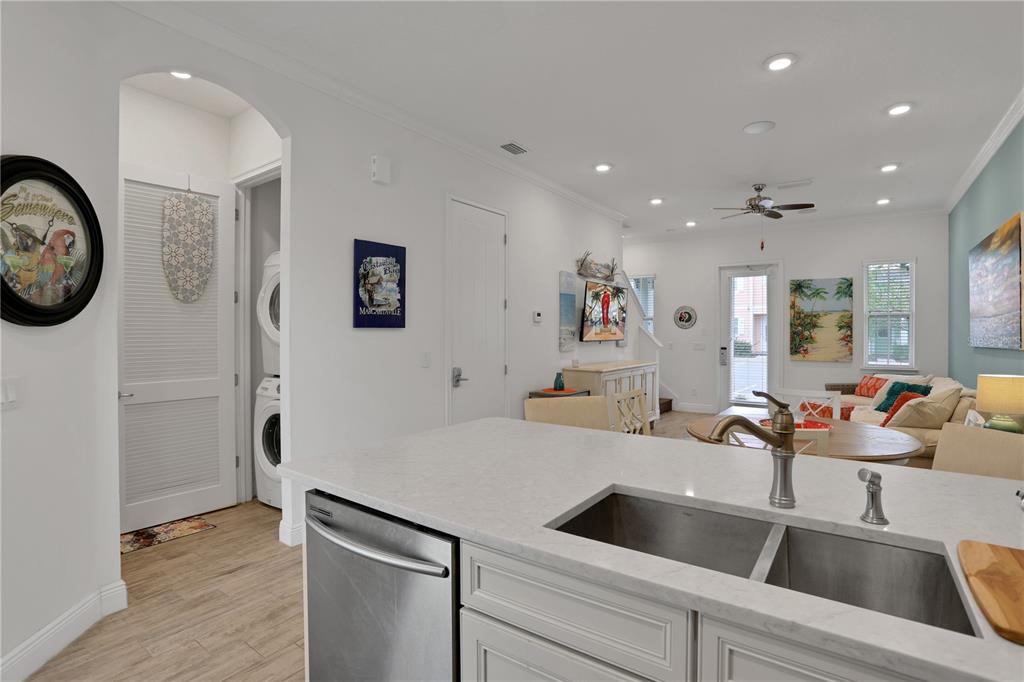 3083 Key Lime Loop Kissimmee, FL 34747 - Photo 19 of 82 a view of kitchen with sink refrigerator and wooden floor