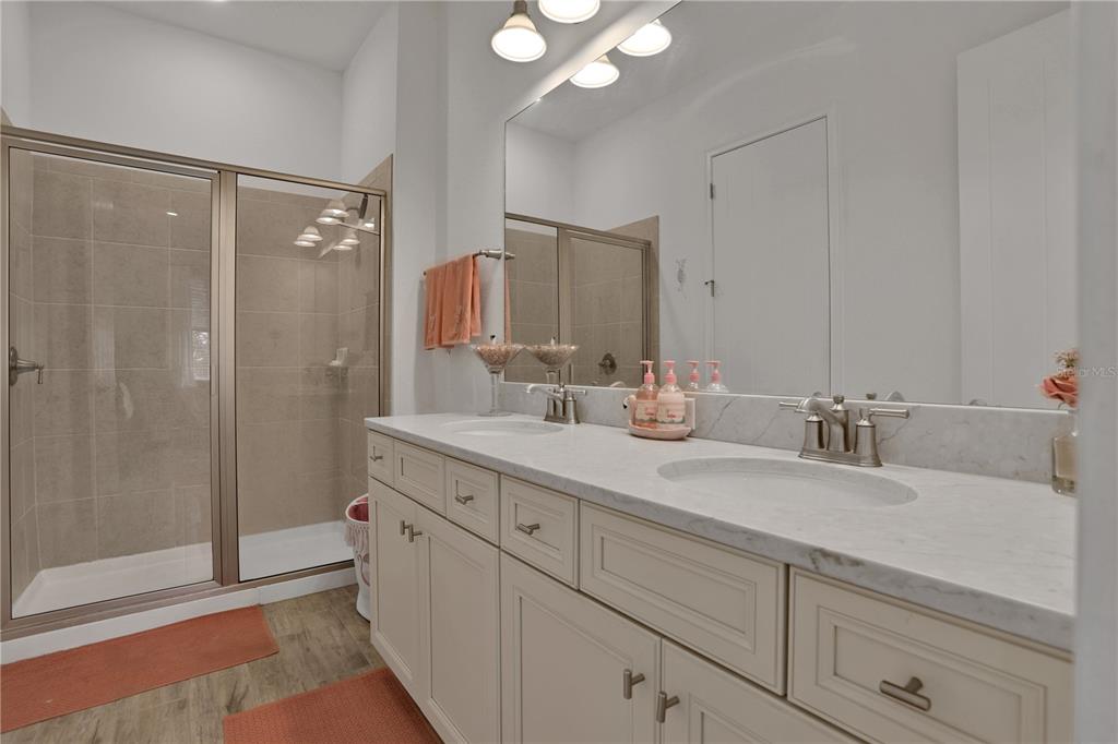 3083 Key Lime Loop Kissimmee, FL 34747 - Photo 25 of 82 a bathroom with a double vanity sink mirror and shower