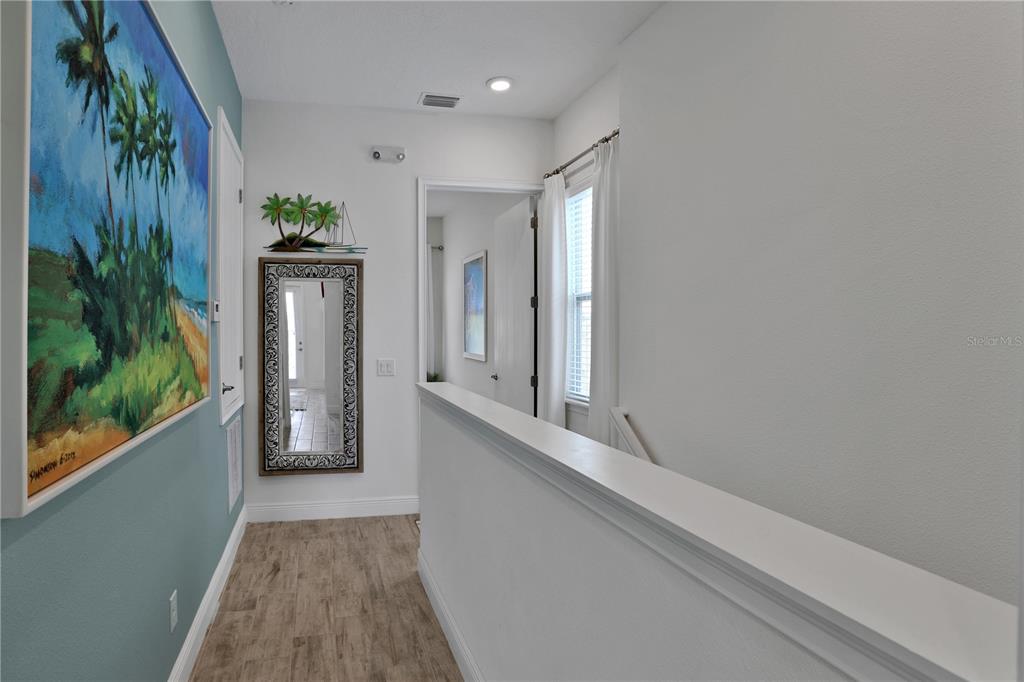 3083 Key Lime Loop Kissimmee, FL 34747 - Photo 26 of 82 a view of an entryway with wooden floor