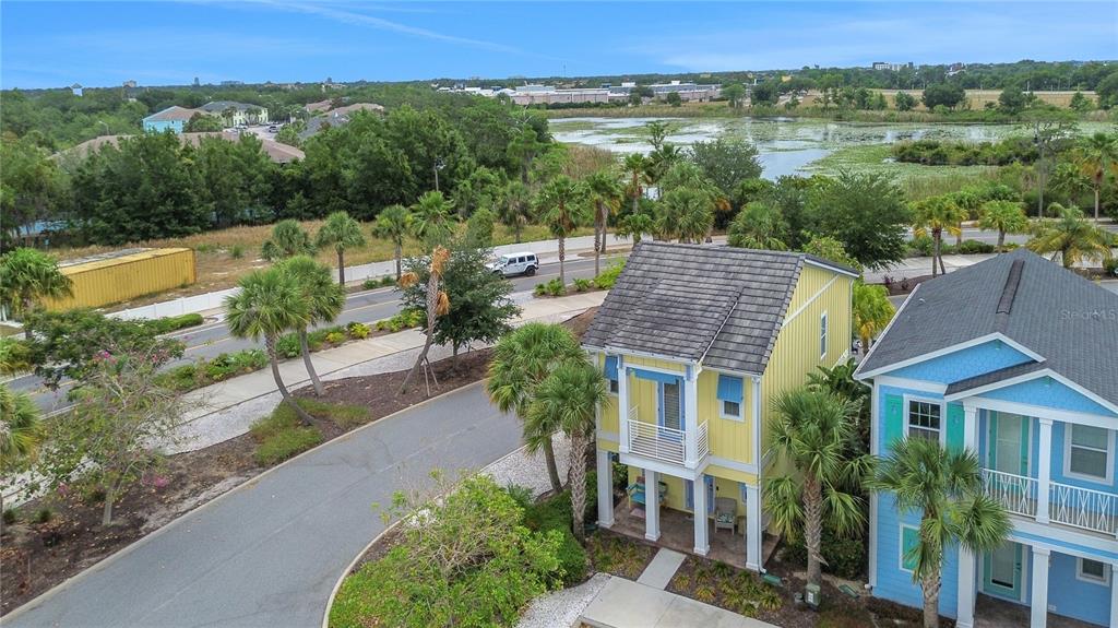 3083 Key Lime Loop Kissimmee, FL 34747 - Photo 41 of 82 an aerial view of a house with a yard and lake view
