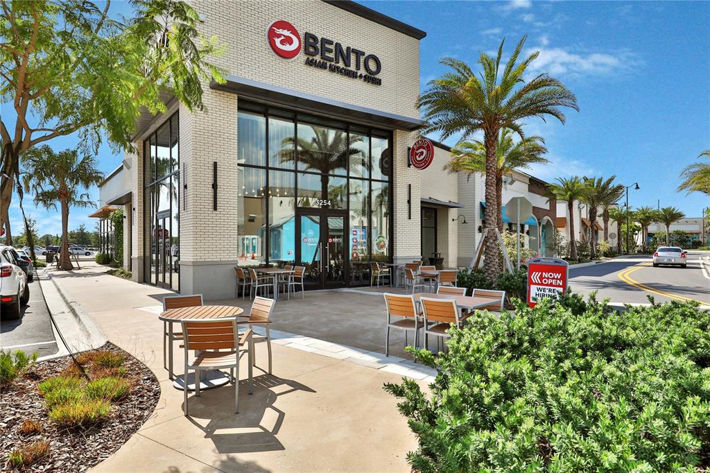 3083 Key Lime Loop Kissimmee, FL 34747 - Photo 75 of 82 a view of a patio with table and chairs and potted plants