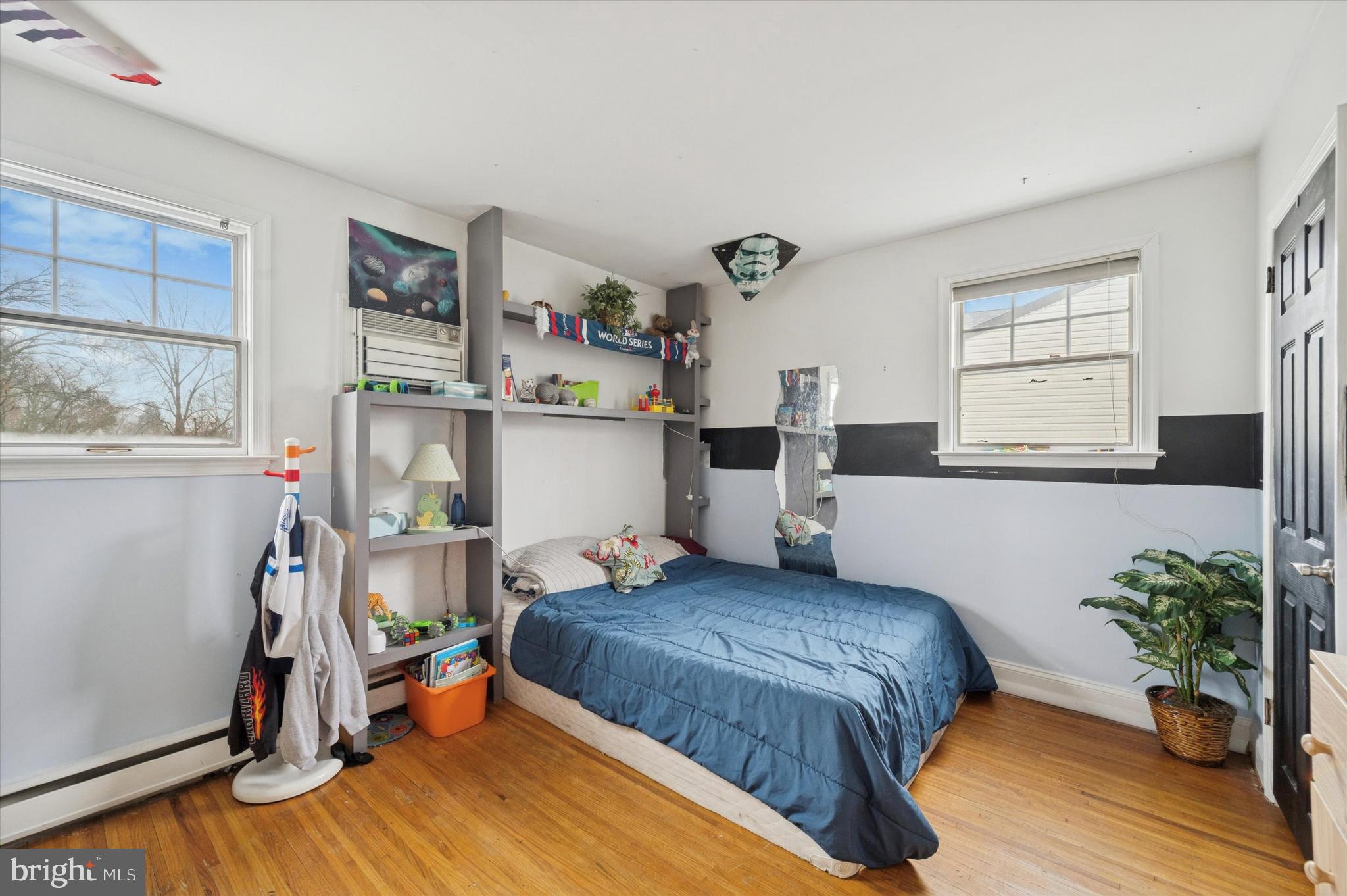 42 Colonial Road Havertown, PA 19083 - Photo 15 of 27 a bedroom with a bed and a potted plant on the dresser
