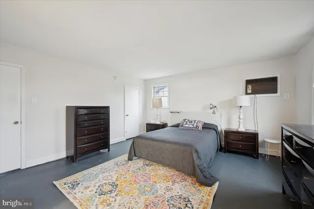 a bedroom with a bed and a television