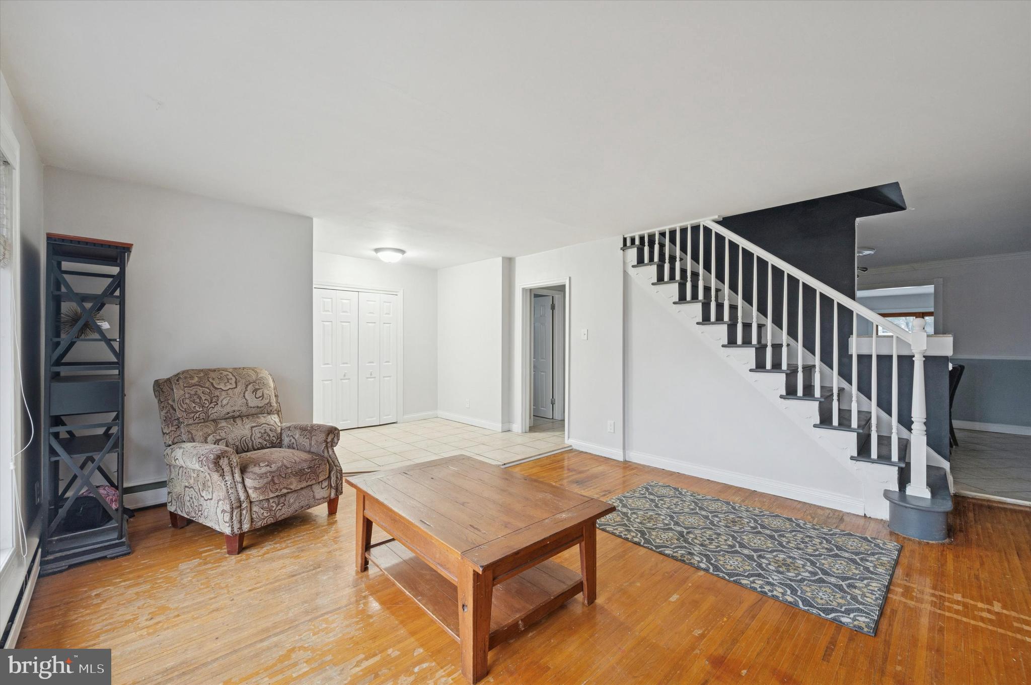 42 Colonial Road Havertown, PA 19083 - Photo 5 of 27 a living room with furniture and stairs