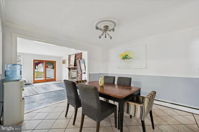 a view of a dining room with furniture and window
