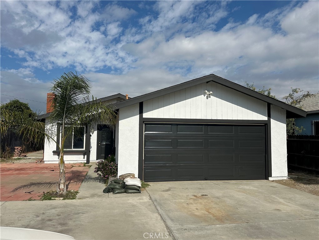 18838 3rd Street Bloomington, CA 92316 - Photo 2 of 2 a front view of a house with a yard