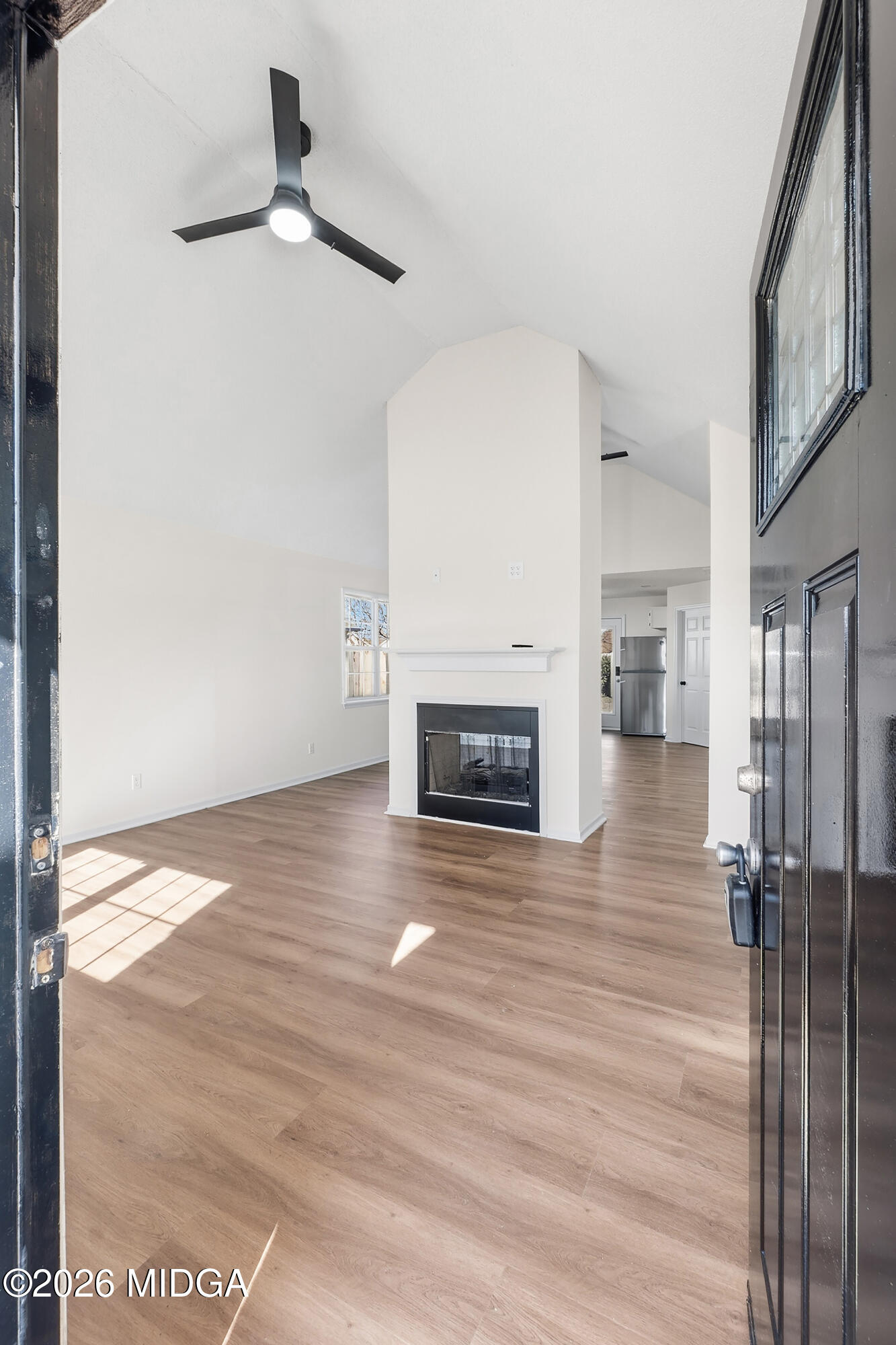 404 Wynfield Lane Bonaire, GA 31005 - Photo 2 of 45 a view of a livingroom with wooden floor a fireplace