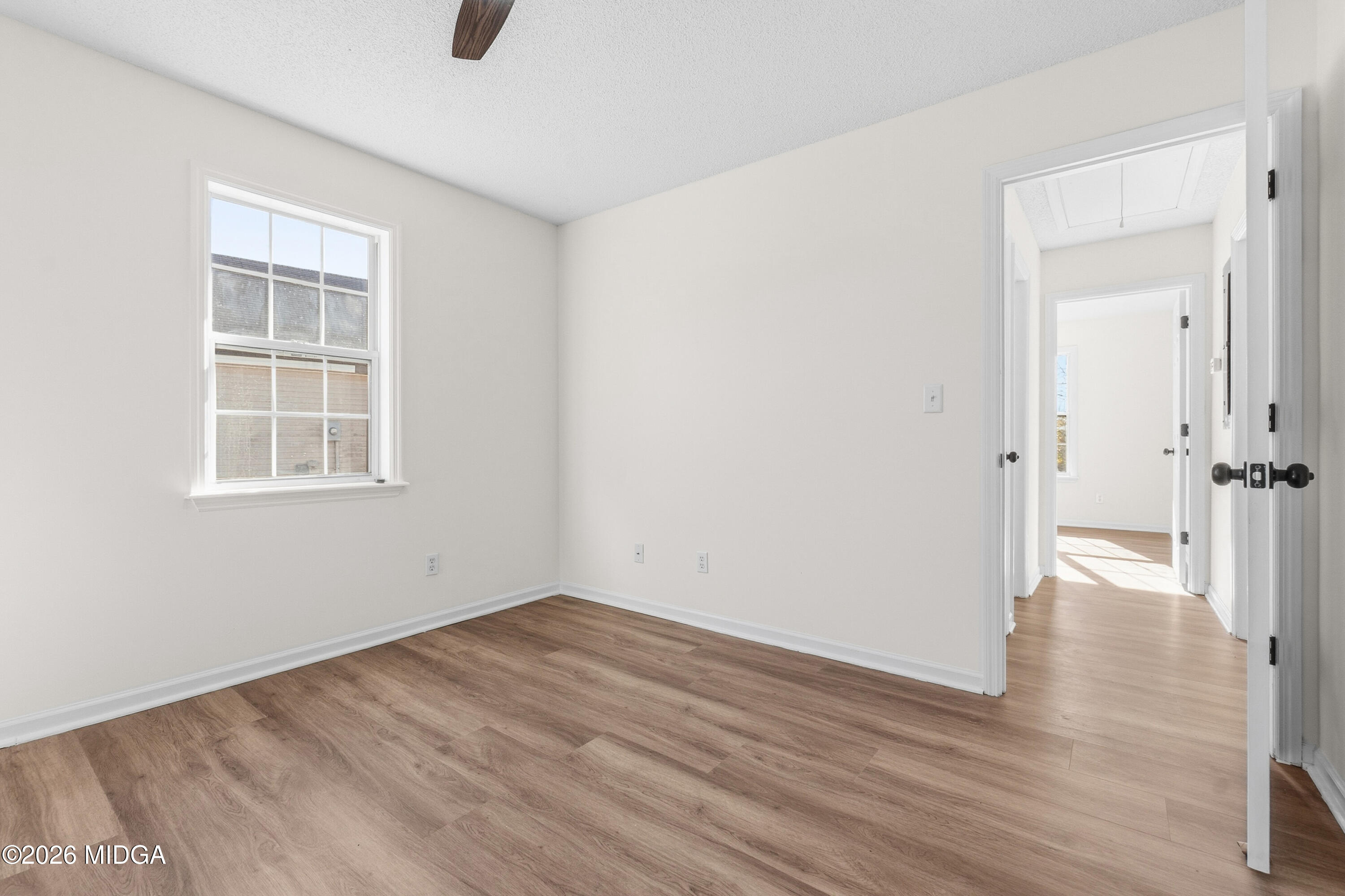 404 Wynfield Lane Bonaire, GA 31005 - Photo 26 of 45 an empty room with wooden floor and windows