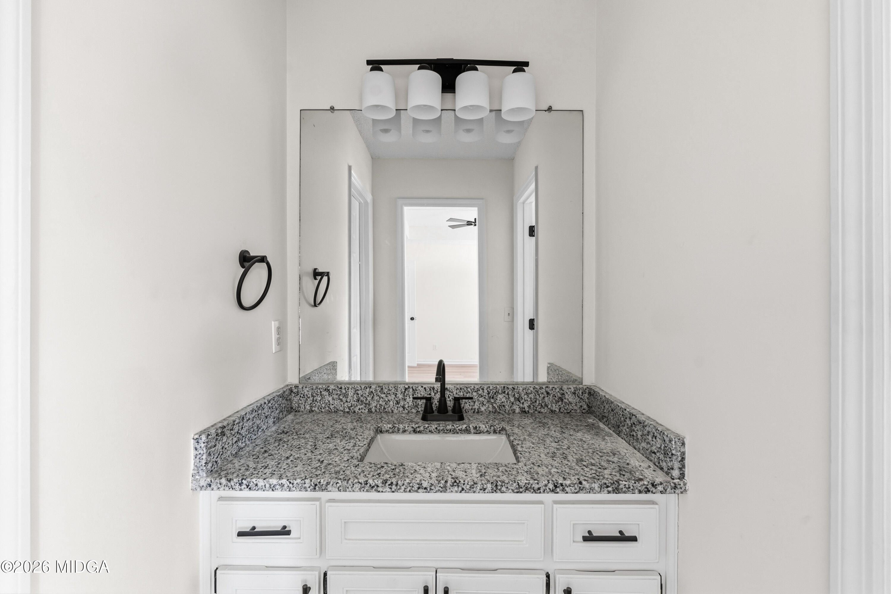 404 Wynfield Lane Bonaire, GA 31005 - Photo 30 of 45 a bathroom with a granite countertop sink and a mirror