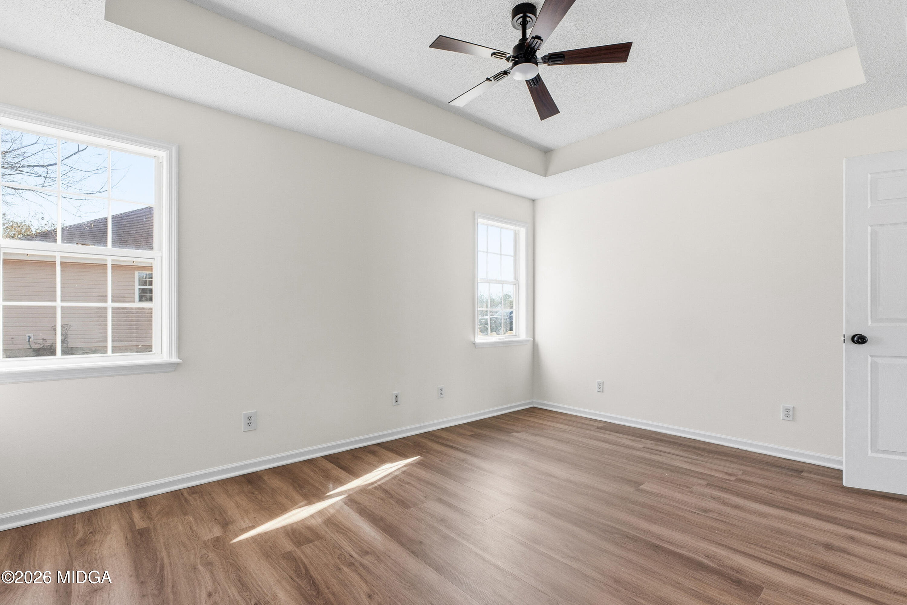 404 Wynfield Lane Bonaire, GA 31005 - Photo 32 of 45 a view of empty room with wooden floor and fan