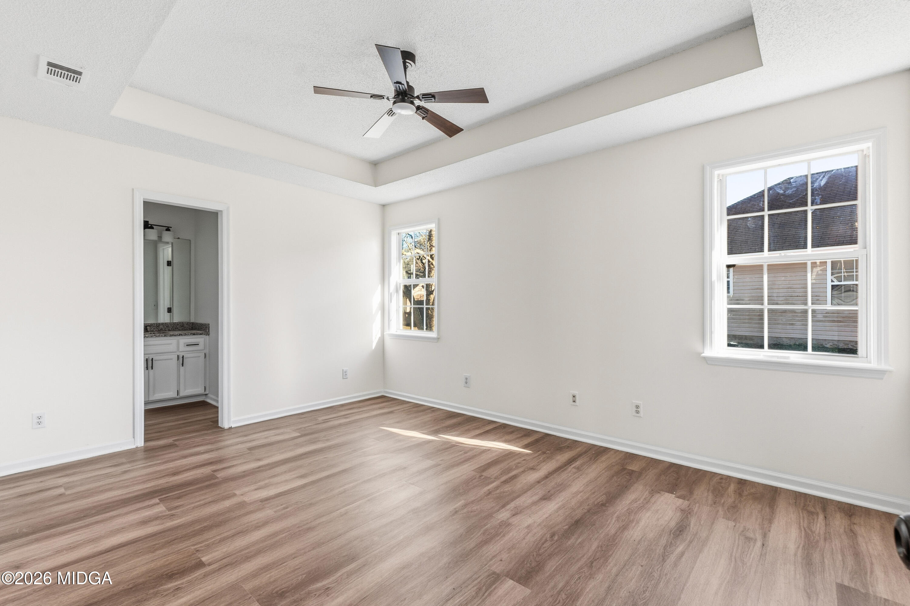404 Wynfield Lane Bonaire, GA 31005 - Photo 35 of 45 a view of empty room with wooden floor and fan