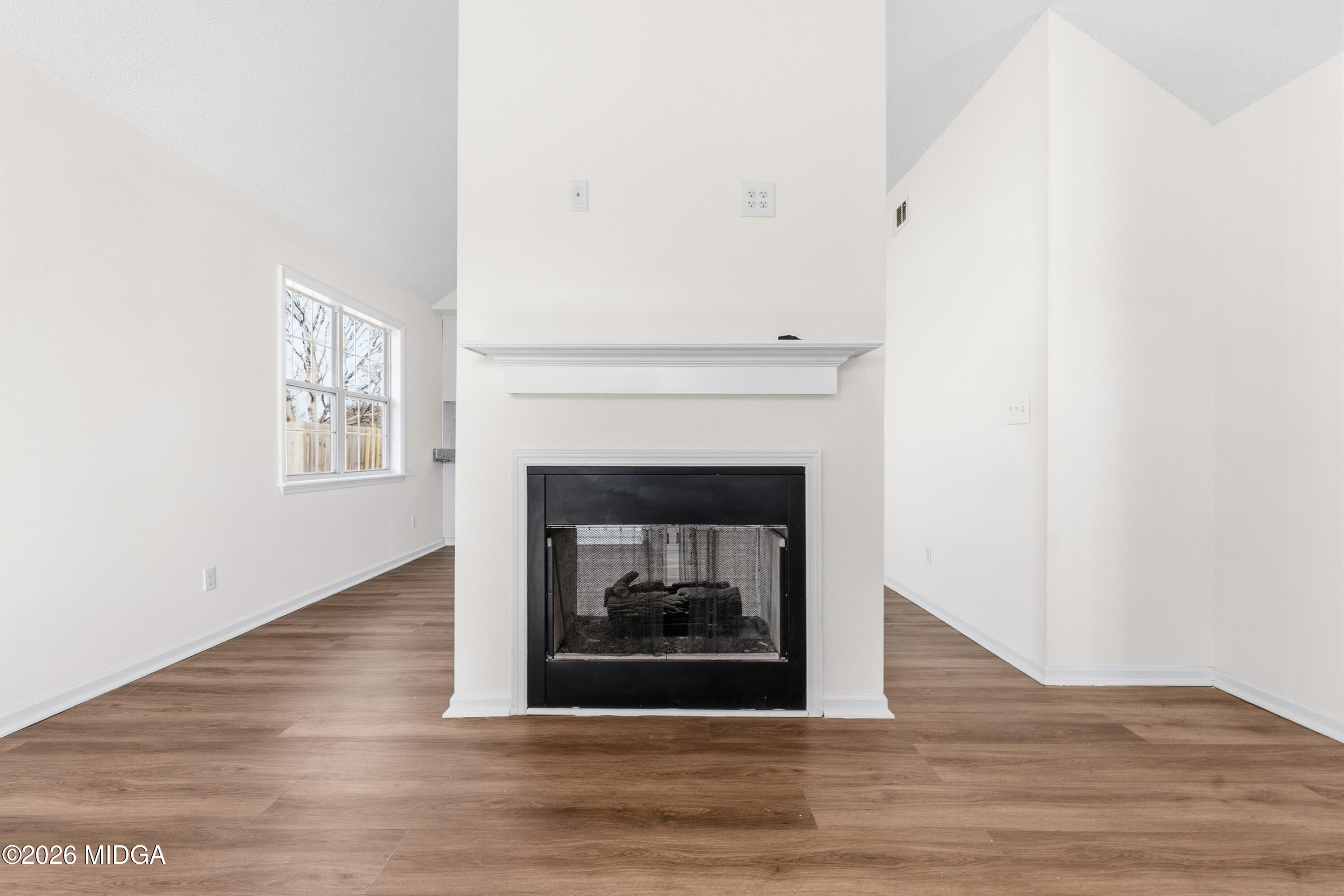 404 Wynfield Lane Bonaire, GA 31005 - Photo 5 of 45 a living room with a fireplace and a fireplace